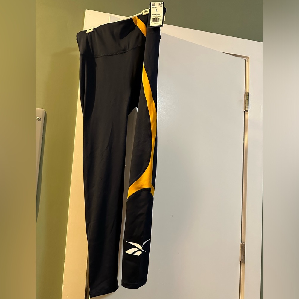 New with tags- Large, Reebok Navy and Yellow Leggings
